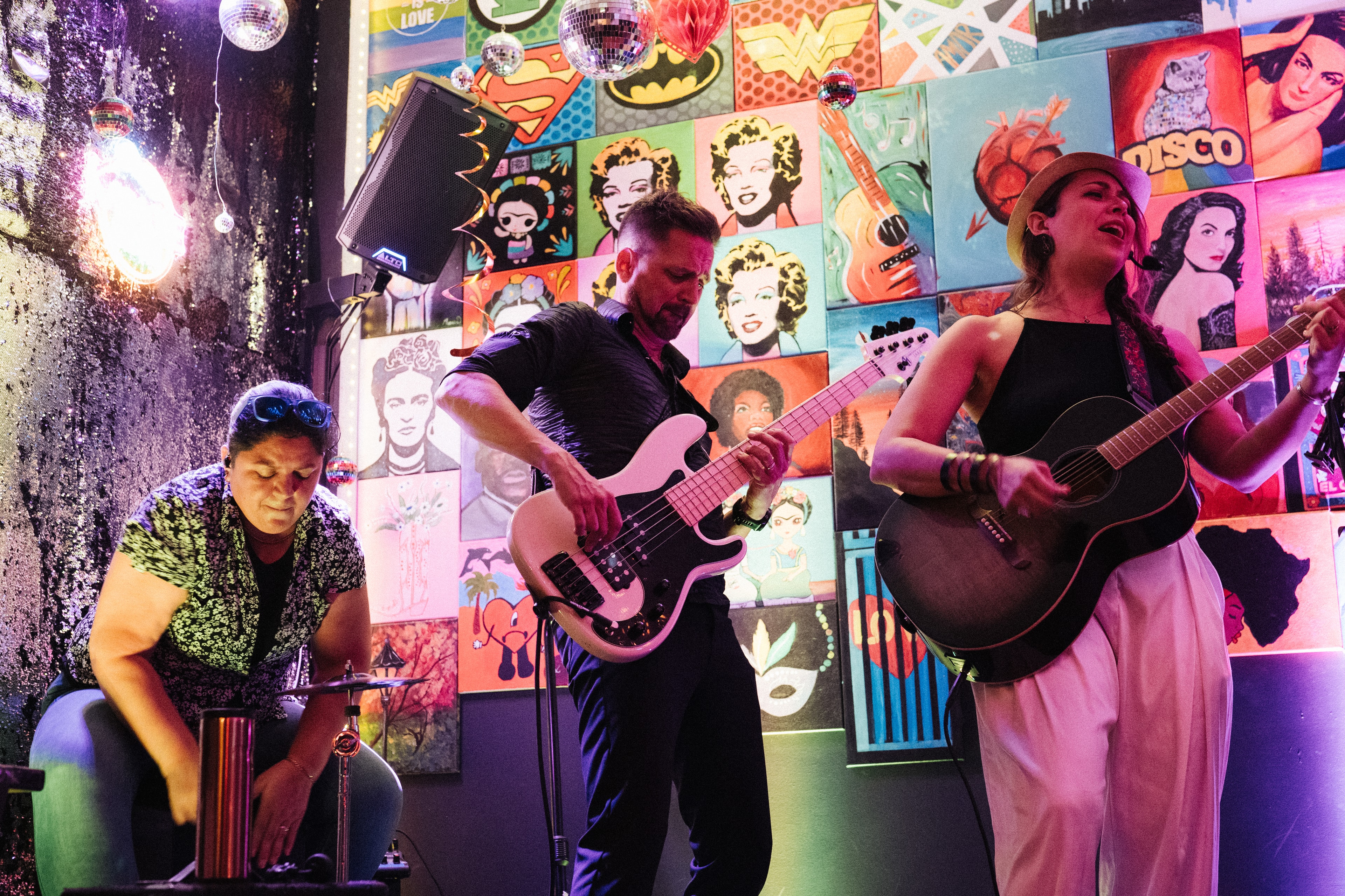 Band performing live colorful pop art backdrop